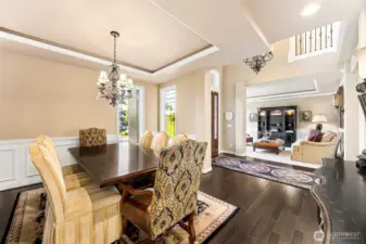 The formal dining room offers the perfect  setting for special gatherings, while to the  left of the front door, the formal living room  invites relaxation and conversation in a  sophisticated space.