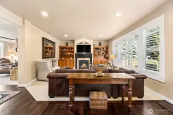 In the family room you'll find fresh updates  including interior shutters, warm neutral  colors & built ins.