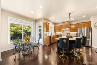 Gleaming hardwood floors really shine  throughout the entry, kitchen & formal dining  room.