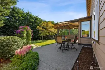 Lush & private backyard with both sun & shade.