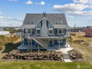 Beautiful ocean-facing deck wraps around the back of the house.