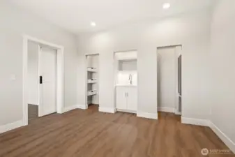 Bonus room on entry level, 6th bedroom or prefect home office. Built-in storage, small fridge and sink.