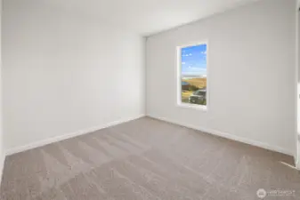 Bedroom down the hallway past the guest bathroom.