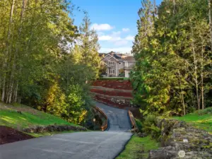 A wide paved drive makes for a grand entrance.