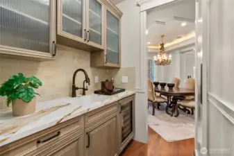 A wet bar located between the kitchen and dining room makes entertaining easy.
