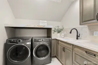 Second-floor laundry room serving the second-floor bedrooms.