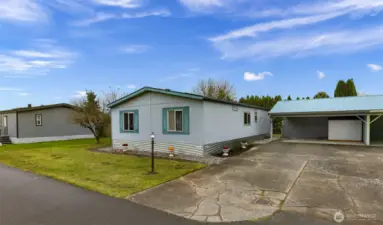 Move In Ready!  Best interior layout in the Mountain Vista Park.  Mountain Vista is a coveted All AGES park in Ferndale on the East side of Main St.  Plus, it's pup friendly! This park provides a nice spacious carport with barn door type slider to its storage area and a metal utility shed.  $575 covers your park maintenance (example - the night light seen in this picture & carport) yes, the carport is provided by Mountain Vista.