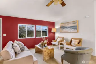 During the spring, enjoy viewing apple blossoms.  This living room is spacious!