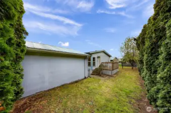 Full view of the nice long back yard that is fenced and feels very private.  Carport/storage building is owned by the Mountain Vista Park.