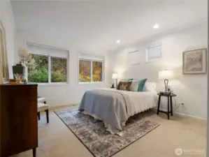 The oversized primary suite allows for a sitting area in addition to your king size bed.