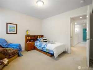 The first bedroom is located conveniently next to the full bathroom.