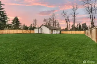 Step into your large backyard, notice the outdoor shed for storage