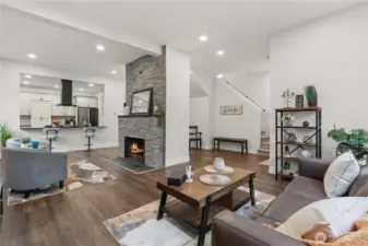 Enter the Main Floor off N 9th into the Living Room w/Floor to Ceiling Stacked Stone Wood-Burning Fireplace is Open to the Kitchen. New Laminate Floors!
