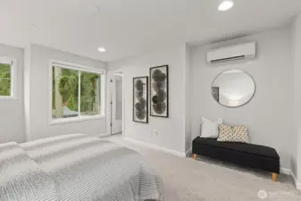 Primary bedroom with ensuite bathroom & walk-in closet (staged)