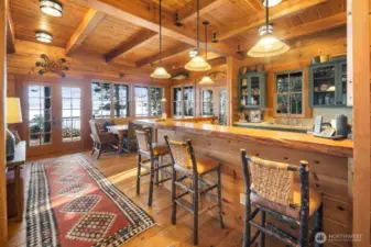 LIVE EDGE DOUGLAS FIR BAR SURROUNDING THE KITCHEN