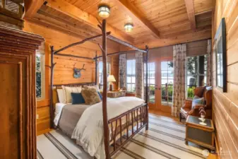MAIN FLOOR BEDROOM WITH FRENCH DOORS OUT TO THE DECK