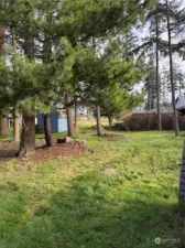 Back yard has a small storage shed and a large Shop with power and water.