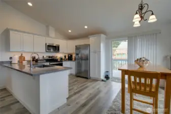 Huge kitchen with dining and counter-eating space.