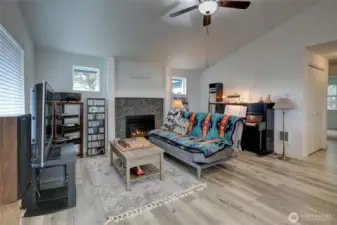Cozy river rock propane fireplace.