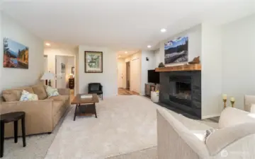 Looking back: The hall on the left takes you to the primary suite and guest bed and bath.