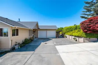 Accessible of of either street this two car garage walks in through the utility room to main level living...