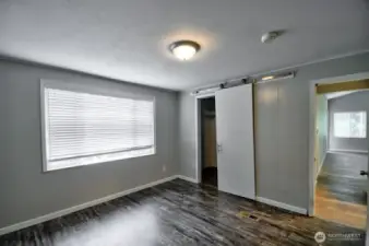 Another view of the primary bedroom