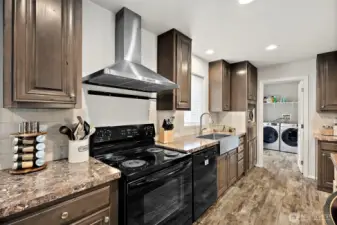 Range with modern stainless steel hood.
