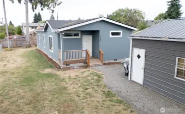 Front of house with partial view of Garage