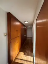 Hallway to bedrooms & bathroom w/tons of built-in storage