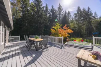 The south facing porch will be your favorite place to unwind. Elevated, with access off the dining room and room for everyone, you'll soon realize that it's easy to find any excuse to spend time on the back deck.