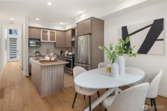 Looking across the dining area to the kitchen from the back door.