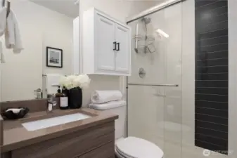 The second bath features an oversized walk-in shower with designer tile.
