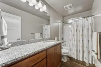 Upper level main full bath.