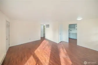 Living room with brand-new flooring and a modern, cozy feel.