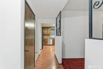 Inside main entry.  Living room to the right, Kitchen straight ahead