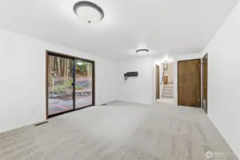 Family room n the lower level, patio door to the left