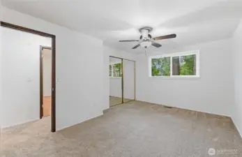 Primary Bedroom with new carpet, fresh paint and new window.