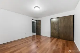 Bedroom#3 with new hardwood floor, new window and fresh paint.