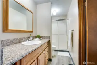 Hall Bath with Door to Bedroom 1 and Hallway