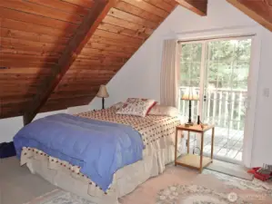 Upstairs 1st Bedroom w/ slider to the Rear Deck.