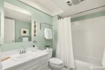 Guest Bath (Full) with tile surround and tile flooring.