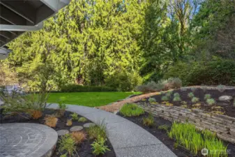 Lovely stonework and planned garden space by Kia Macaud.