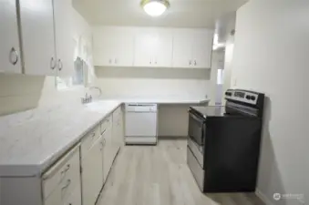 New counters in this clean, walk-around kitchen. Lots of cabinets