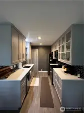 This kitchen is updated with undercounter lighting and gorgeous countertops and cabinets