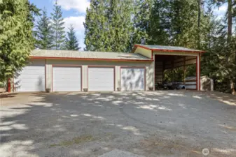 4-bay 1,620 square foot shop with over-sized RV/boat carport and additional storage shed