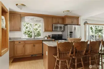 The heart of the home - huge Kitchen Island and bar with seating for 4-6