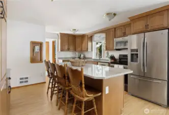 Kitchen Island looking into hall with powder bath on right
