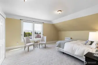 Large bedroom upstairs, could be primary with views of peek a boo views of the Bay.