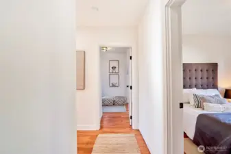 Upper level hallway leading to three bedrooms.