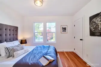 One of 3 upper floor bedrooms featuring refinished original fir floors.